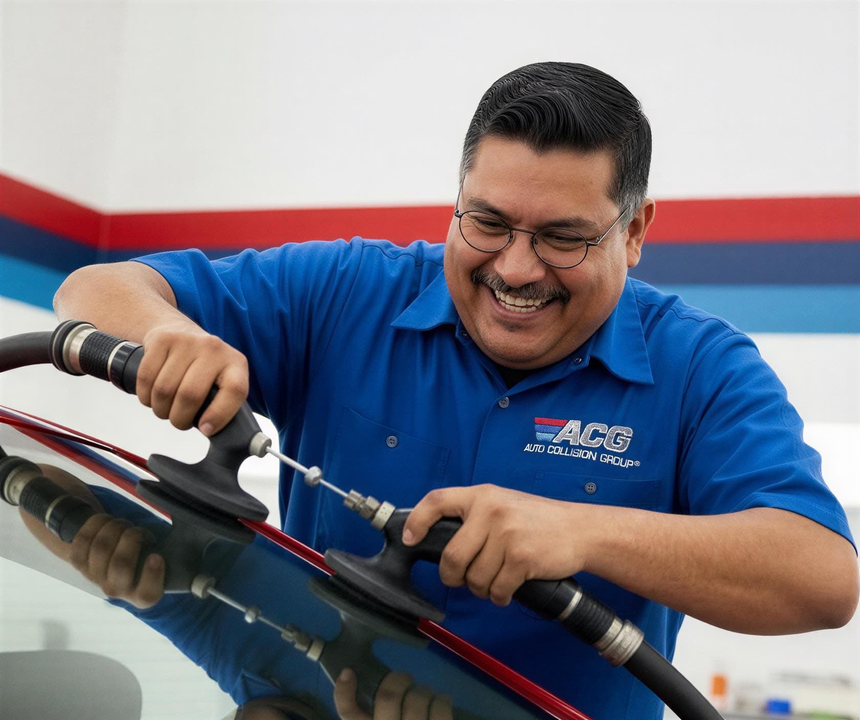 Certified technician performing auto glass and windshield replacement at Auto Collision Group Rancho Cucamonga